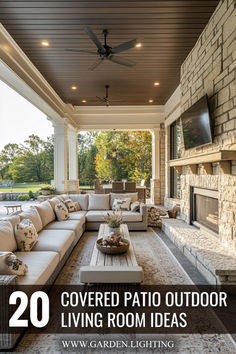 an outdoor living room with couches and fireplace