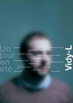 a blurry image of a man's face with words in the background