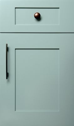 a close up of a cabinet door with a handle on the front and side panel