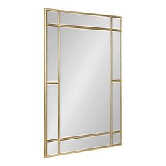 a gold framed mirror on a white wall