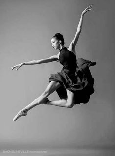 a black and white photo of a ballerina