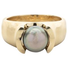 Designer: custom design Material: 18k yellow gold Tahitian Pearl: 9mm Ring Size: 8 ½ (please allow two additional shipping days for sizing requests) Dimensions: ring top measures 16.85mm by 15.54mm Weight: 12.12 grams Ring Pearl Modern, Pearl Ring Design, 9mm Ring, Tahitian Pearl Ring, Black Pearl Ring, Pearl Rings, Tahitian Pearls, Black Pearl, Tahiti