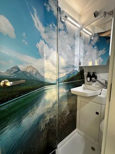 a bathroom with a large mural on the wall