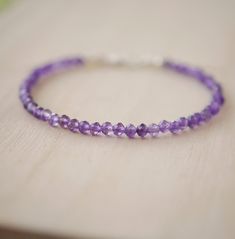 Wrap yourself in sparkle with this faceted Amethyst bracelet! Amethyst, the purple variety of Quartz, is said to encourage selflessness and spiritual wisdom, while improving motivation. It is a meditative gem that aids in providing a sense of calm, balance, and peace--who wouldn't want to tap into that goodness? Our bracelet is handmade in sterling silver or 14k gold filled with natural, micro-faceted Amethyst for extra sparkle! GEMSTONE: Natural Purple Amethyst STONE SIZE: 3mm (.1") SIZING: Ple Purple Faceted Amethyst Beaded Bracelets, Purple Amethyst Faceted Beaded Bracelets, Faceted Purple Amethyst Beaded Bracelets, Spiritual Purple Faceted Beaded Bracelets, Spiritual Faceted Purple Beaded Bracelets, Faceted Purple Beaded Bracelets, Purple Faceted Spiritual Bracelets, Spiritual Purple Faceted Bracelets, Purple Rondelle Beaded Gemstone Bracelets