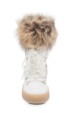 A water-repellent winter boot featuring fluffy faux-fur trim brings out futuristic vibes while a rubber sole is ready to trek through the city and mountains. Removable insole Lace-up style Water-repellent Textile, synthetic and synthetic faux-fur upper/textile lining/rubber sole Imported Trendy Weatherproof Winter Boots, White Insulated Winter Boots, White Boots For Winter Sports, White Boots For Cold Weather, White Boots With Plush Lining For Winter, White Winter Boots With Plush Lining, White Plush Lined Winter Boots, White Plush-lined Boots For Winter, White Faux Fur Trimmed Boots