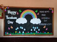 a chalk board with rainbows, rain drops and words on it that say happy teachers day