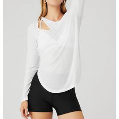 Alo Ribbed Peak Long Sleeve. Iconic Asymmetrical Look, Rounded Hem, High Neckline And High Slits. Ultra Lightweight Tissue Rib. New Without Tags Alo Yoga White Long Sleeve Tops, White Long Sleeve Alo Yoga Top, Trendy Alo Yoga Tops, Alo Yoga Fitted Versatile Tops, Alo Yoga Versatile Fitted Tops, White Stretch Alo Yoga Top, Alo Yoga White Stretch Top, Alo Yoga White Tops For Spring, Fitted White Alo Yoga Top