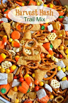 a bowl full of halloween themed trail mix with the words harvest mash on it