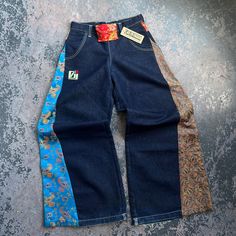 JNCO Paisley Print Denim Jeans, size 1. 65% cotton, 35% polyester, Made in USA.  Measurements:  Waist: 30"  Length: 42.5"  Inseam: 33.25"  We do our best to show all flaws of any garment through the pictures. Please check pictures for condition.    Exported By ExportYourStore :) Multicolor Denim Patchwork Pants, Multicolor Patchwork Denim Pants, Blue Denim Floral Print Pants, Blue Denim Pants With Floral Print, Blue Floral Print Denim Pants, Blue Floral Print Wide Leg Jeans, Mid-rise Cotton Bottoms With Floral Print, Mid-rise Cotton Floral Print Bottoms, Mid-rise Floral Print Cotton Bottoms