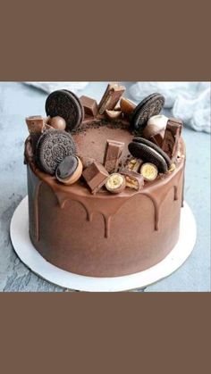 a chocolate cake with cookies and oreo pieces on top