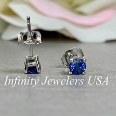 "The stud earrings pictured are lab created blue sapphire #5926 -Approximate total carat weight: .50ctw -Center Stone Size: 4mm - approx. .25ct each diamond equivalent -Gem Type: lab created sapphire -Stone Shape: round -Stone Clarity: VS2 -Stone Color: Blue - Shown in friction backs -Metal Type and Purity: 14k white gold -Setting: 4 prong basket style -Backing: Friction back (earring backs are subject to change due to availability) -Country of Manufacturing: USA (Michigan) For customization ple Sapphire Round Cut Earrings For Anniversary, Sapphire Round Cut Anniversary Earrings, Blue Brilliant Cut Earrings For Anniversary, Brilliant Cut Sapphire Earrings For Anniversary, Blue Sapphire Earrings For Anniversary, Blue Earrings With Prong Setting For Anniversary, Classic Blue Sapphire Earrings, Classic Blue Lab-created Sapphire Earrings, White Gold Sapphire Birthstone Earrings