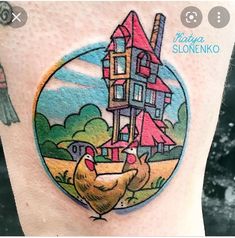 a woman's leg with a house and chickens on it