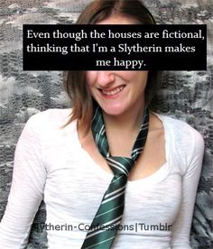 a woman wearing a green tie with a quote from the harry potter series on it