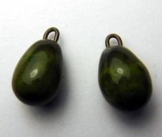 two green beads sitting next to each other