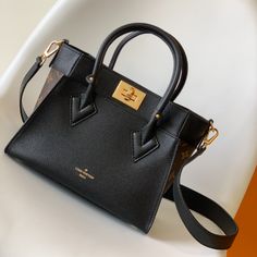 This small On My Side handbag combines soft calfskin with classic Monogram canvas side lining, with a detachable wide shoulder strap for shoulder and crossbody experience, top handle Add the option of carrying it by hand or by the elbow. Large outer pocket for easy access to items.

Size: 25.0 x 20.0 x 12.0 cm (LxHxW)
• Monogram coated canvas and calfskin
• Leather trim
• Microfiber lining
• metallic parts High-end Crossbody Satchel For Shopping, Luxury Monogram Canvas Shoulder Bag With Detachable Strap, Light Luxury Crossbody Bag With Branded Hardware, Monogram Canvas Satchel Shoulder Bag With Detachable Strap, Monogram Canvas Satchel With Detachable Strap, Luxury Monogram Canvas Crossbody Shoulder Bag, High-end Monogram Canvas Bag With Gold-tone Hardware, High-end Monogram Canvas Bags With Gold-tone Hardware, High-end Monogram Canvas Satchel