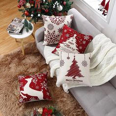 a living room filled with furniture and christmas decorations on top of a carpeted floor