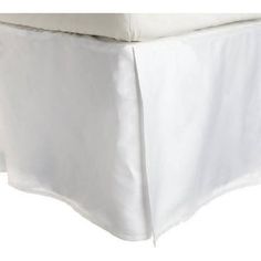 the bed skirt is white and has a ruffled edge