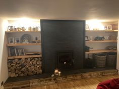 a living room with a fire place and bookshelves