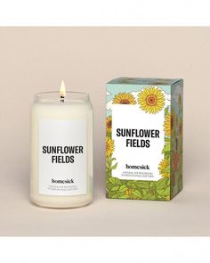 a sunflower fields candle next to a box