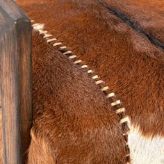 a close up view of the side of a cow's fur with zippers