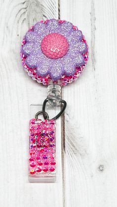 Flower Nursing Badge Reel, Nurse Practitioner Gifts, Retractable Badge holder, Cute Nurse Badge Reel, New nurse gifts Are you tired of wearing boring generic work ID badges? Look no more! Our designer badge reels are fun and fashionable!  Everyone deserves something to make them smile while at work. Our retractable badge holders are perfect for securing your ID name badge to your work uniform.   Our work accessories are the perfect gift for medical staff, nurses, nursing students, doctors, PA's, Multicolor Retractable Badge Reel For Gift, Pink Badge Reel With Swivel Clip As Gift, Adjustable Novelty Pink Badge Holders, Pink Badge Holder With Swivel Clip As Gift, Personalized Pink Badge Holders For Crafting, Adjustable Purple Badge Holders As Gift, Nursing Badge Reel, Nurse Practitioner Gifts, Nursing Badge