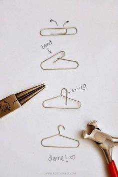 there are several pairs of scissors and paper clips next to each other on top of a piece of paper