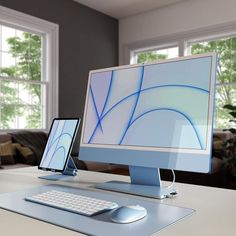 a computer monitor sitting on top of a desk next to a keyboard and mouse in front of a window