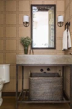 a bathroom with a sink and mirror on the wall