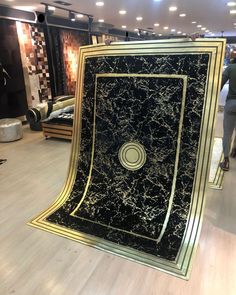 a large black and gold carpet in a store