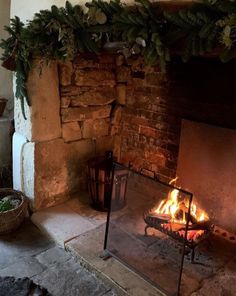 a fireplace with a fire burning inside of it