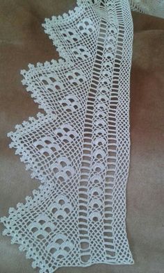 white crocheted lace on brown fabric