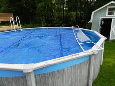 an above ground swimming pool in a backyard