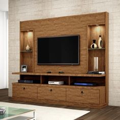 a living room with a television and entertainment center