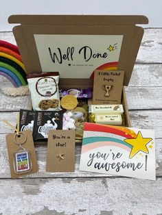 the well done gift box is filled with cards, tags and other items for someone's birthday