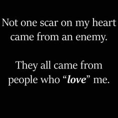 a black and white photo with the words, not one scar on my heart came from an enemy they all came from people who love me