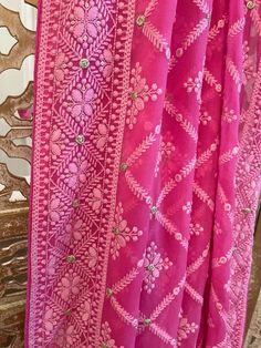 A very very pretty Chikankari saree in pure georgette in a lovely candy pink shade with all over jaal (barfi pattern) embroidery with mukaish work (embellishments). The pallu is short but features intricate designs. The entire saree has the same pattern from the very beginning of the saree except the portion you have to tuck in so that it doesn't bulge. Entire saree is framed in cord piping, best quality satin falls are attached and picot stitching is done as well. The blouse piece is separated Pink Saree With Intricate Embroidery, Pink Embroidered Saree, Pink Saree With Intricate Embroidery For Diwali, Festive Pink Saree With Intricate Embroidery, Pink Dupatta With Intricate Embroidery In Traditional Drape, Pink Dupatta With Intricate Embroidery, Pink Semi-stitched Saree With Intricate Embroidery, Traditional Pink Saree With Intricate Embroidery, Pink Dupatta With Resham Embroidery In Georgette