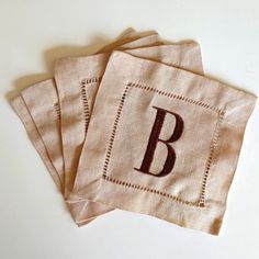 three burlap bags with the letter b on them