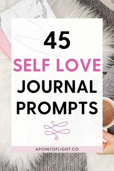 a person holding a cup with the words, 45 self love journal prompts on it