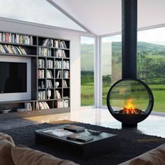 a living room filled with furniture and a fire place in front of a flat screen tv