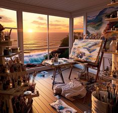 an artist's studio with the sun setting over the ocean in the background and lots of art supplies on the floor