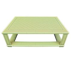 a green coffee table sitting on top of a white floor