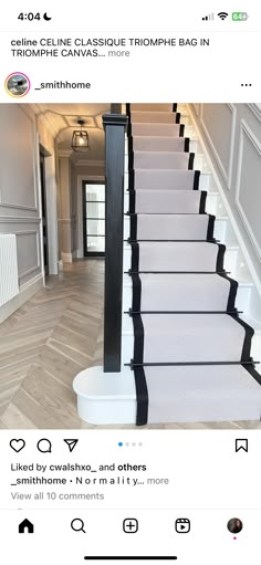 the stairs in this house have black and white trimmings on each handrail