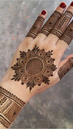 a woman's hand with hennap on it, showing the intricate design