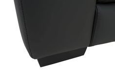 the back end of a black leather chair