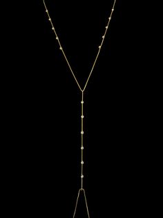 Upgrade your beach look with our Arena Body Chain! Made with 18k gold-filled material and sparkling cubic zirconia stones, this body chain is stylish and water-resistant. Perfect for any water activities, it adds a touch of glam to your swimwear. Get yours now and shine like a star! DETAILS: * 18k gold-filled, Cubic zirconia, Water resistant MEASUREMENTS: * Body chain length: 31.5 Inches CARING TIPS * Avoid contact with lotions & perfumes as these can tarnish the jewelry * Keep jewelry clean and Adjustable Gold Necklaces With Diamond Accents, Gold Cubic Zirconia Lariat Necklace, Gold Cubic Zirconia Lariat Necklaces, Shine Like A Star, Body Necklace, Gold Bodies, Waterproof Jewelry, Belly Chain, Demi Fine Jewelry