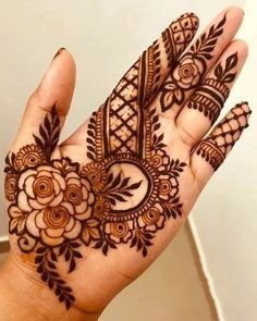 a hand that has some henna on it