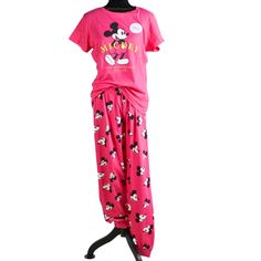 This Is A Brand New With Tags Women's Disney Hot Pink Mickey Mouse T-Shirt & Joggers Pj Set. This Adorable Set Features A Vibrant Magenta Hot Pink Color, A Short Sleeve T-Shirt Detailed With A Mickey Mouse Graphic, "Mickey" In Raised Neon Yellow Lettering, And "Walt Disney Studios Est. 1928" In The Same Color Below. This Set Also Comes With Matching Jogger Style Pants Detailed With A Mickey Mouse Pattern And Elastic Waistband. Made With Sustainable Cotton. Disney X Primark Exclusive! Approximate Flat Measurements: Us Women's Size S / 6-8 Top: Chest: 20" Length: 25" Bottoms: Waist: 15.25" Inseam: 31" Length: 40" Us Women's Size Xl / 14-16 Top: Chest: 25" Length: 27.5" Bottoms: Casual Cotton Mickey Mouse Sleepwear, Minnie Mouse Cotton Sleepwear, Cotton Minnie Mouse Sleepwear, Mickey Mouse Cotton Sleepwear For Loungewear, Cotton Mickey Mouse Sleepwear For Loungewear, Minnie Mouse Cotton Sleepwear For Pajama Party, Minnie Mouse Cotton Sleepwear For Loungewear, Cotton Minnie Mouse Sleepwear For Pajama Party, Cotton Minnie Mouse Sleepwear For Loungewear