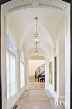 the hallway is clean and ready for guests to use it as an entrance way in this home