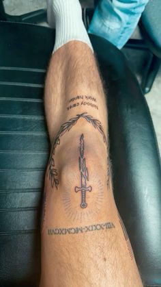 a man with a tattoo on his leg