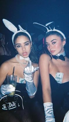 two women dressed in bunny ears at a party